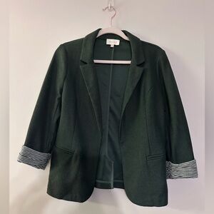 Skies are blue textured green blazer